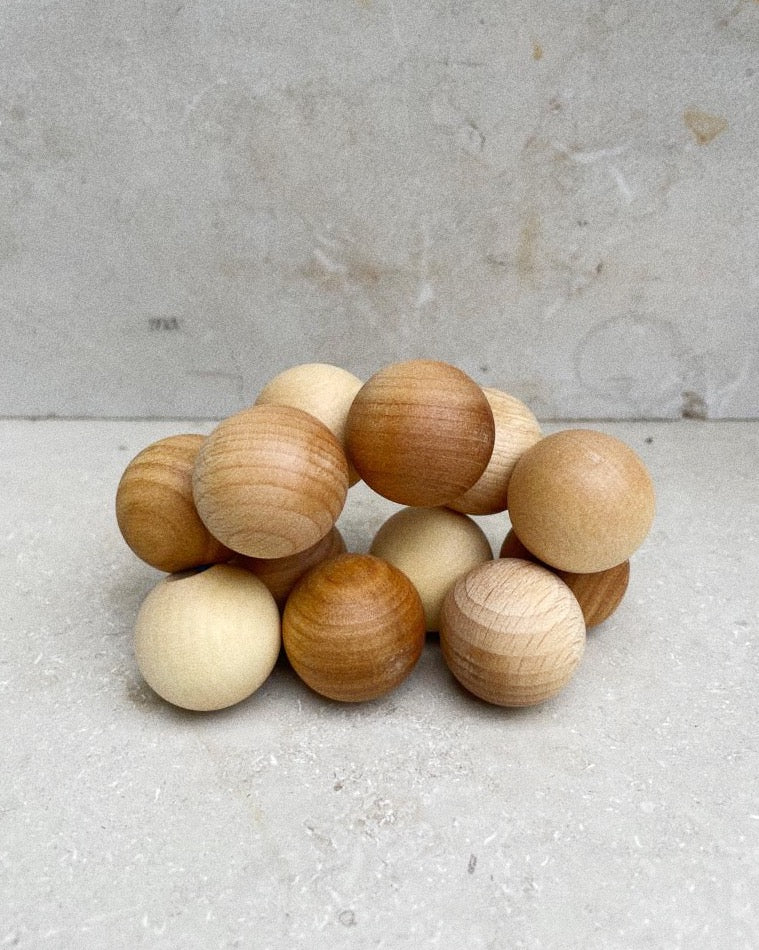 Wooden beads on a ribbon, baby toy